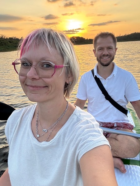 Isabell and Sven Haase stand-up paddling at sunset